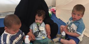 Shayma Assaad and her three sons in her tent at the al-Hawl camp.