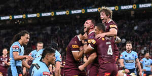 Kurt Capewell celebrates scoring a try with teammates during Origin game three in 2022.