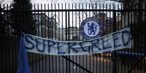 A protest banner hangs from the gates of Chelsea’s ground at Stamford Bridge.