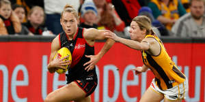 Essendon’s Steph Cain is chased by Hawthorn’s Tahlia Fellows in last year’s opener.