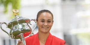 Ash Barty celebrates with the trophy the day after winning the Australian Open.