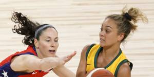 Leilani Mitchell of the Opals passes against Sue Bird from the US basketball team.