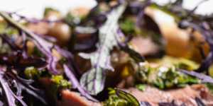 A robust salad of artichokes,borlotti beans,ox heart and salsa verde.