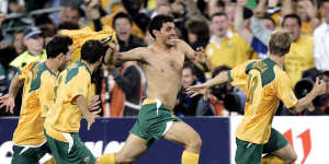 A shirtless John Aloisi celebrates scoring the penalty against Uruguay that put Australia into the 2006 World Cup.