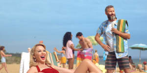 Kylie Minogue and comedian Adam Hills star in Tourism Australia's new $15 million tourism campaign that is designed to attract more British tourists.