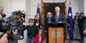 Malcolm Turnbull,pictured with his family,speaks to the media after his party room loss on Friday.