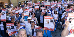 Attendees at the “United with Israel” rally in Martin Place held placards bearing the names and pictures of Israelis kidnapped by Hamas.