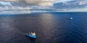 Ocean Cleanup vessels trawl the ocean for plastic using a net during a trial in October 2021.