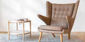 Hans Wegner’s Papa Bear Chair starts at $43,400,but copies are often seen at a much cheaper price.