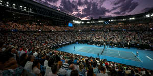 Night for it:A packed Rod Laver Arena watches the match.