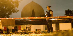 A policeman stands guard at al-Noor Mosque in Christchurch a week after the massacre.