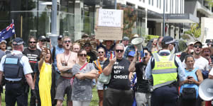 Anti-vaccination mandate protesters encircle National Press Club