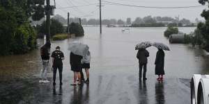 As it happened:Western Sydney residents given all-clear to return home as extreme weather event continues across state;South Coast told to prepare for heavy rainfall