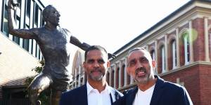 Swans greats Michael O’Loughlin and Adam Goodes unveil the Goodes statue near Swans headquarters last year.