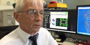 Michael Day and the screens that show how fast - or slow - Canberra traffic moves.