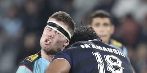 Max Douglas takes the full force of a high tackle from Pone Fa’amausili in a Super Rugby match.