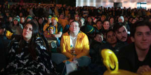 Matildas fans watch the game against Sweden at the Tumbalong Park live site in Sydney.