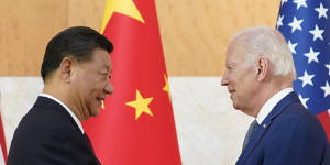 US President Joe Biden and Chinese President Xi Jinping shake hands before their meeting on the sidelines of the G20 summit on Monday.