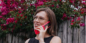 Fifth-year law student and paralegal Lucy Long uses a Barbie flip phone. 