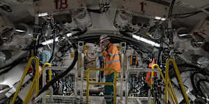 A worker inside the boring machine Jessie,which struck hard rock beneath King Street wharf.