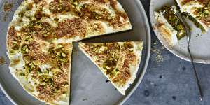 Mafroukeh cake topped with clotted cream,toasted kishk and pistachios.