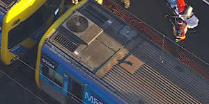 Emergency services at North Melbourne station on Monday afternoon.