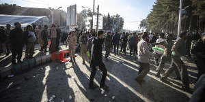 People are seen after an explosion in Kerman,Iran,on Wednesday.