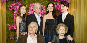 Actor Kirk Douglas,seated left,holds hands with his wife Anne Douglas,seated right,as they pose with family members,their son Michael,standing second left standing,his wife Catherine Zeta-Jones,standing second right standing,and their children,Carys Zeta Jones,left,and son Dylan during Kirk's 100th birthday party at the Beverly Hills Hotel on Friday,Dec. 9. 2016,in Beverly Hills,Calif. (Photo by Chris Pizzello/Invision/AP)