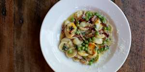 Orechiette with peas and guanciale. 