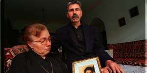 Christina and George Halvagis hold a picture of their murdered daughter,Mersina.