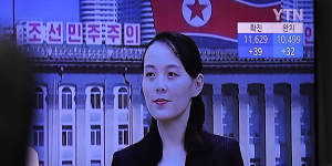 A man watches a TV news program with a file image of Kim Yo-Jong,the powerful sister of North Korea's leader Kim Jong-un,at the Seoul Railway Station in Seoul.