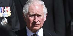 Prince Charles sheds a tear as he follows the coffin at Windsor Castle.