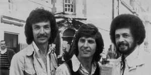 The New World pop group in London,where they were appearing at Bow St Magistrates Court on charges of uttering forged postcards. From left:Mel Noonan,30,John Kane,27,and John Lee,29. June 15,1973. 