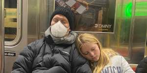 Sam with daughter Scarlett on the New York subway after his hospital stay.