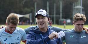 Junior Wallabies coach Jason Gilmore addresses the squad at training on Sunday. 