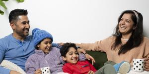 Anshul Wadhwa and Aradhita Nadkarni with their children,Aanya,10,and Asher,7,keep warm in their Randwick flat with hot drinks,blankets and warm clothes.