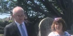 Karen Richards gives Scott Morrison a tour of the St Keverne graveyard.