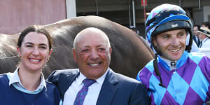 Jockey Declan Bates poses with owner Tony Ottobre and Sammie Waters after Pride of Jenni’s win in the All Star Mile.