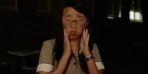 Gabby (Janet Wang) applies blackface in the 2013 short film Bloomers.