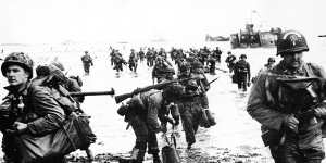 The invasion begins ... US troops come ashore at Normandy.