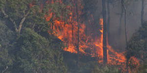 Bushfires still bearing down on western towns as cool change nears