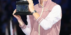 Jannik Sinner with his maiden grand slam trophy for winning the 2024 Australian Open men’s singles title.