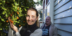 Fruit tree owner Derek McKenzie and Burnley Fruit Squad volunteer Bec Meldrum.