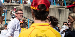 NSW Premier Dominic Perrottet speaks to volunteer surf lifesavers and Coogee nippers on Wednesday.