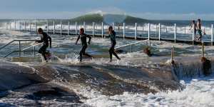 Locals play in the surf at Narrabeen.