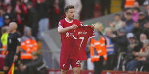 Liverpool’s Diogo Jota celebrates after scoring his side’s opening goal holding the jersey of teammate Luis Diaz during the English Premier League match between Liverpool and Nottingham Forest.