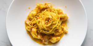 Spaghettini,with the golden glow of saffron,and prawns.