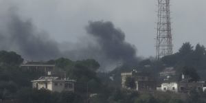 Black smoke rises from an Israeli army position which was hit by Hezbollah heavy missiles.