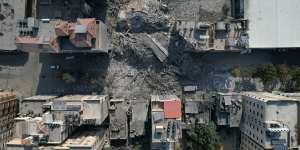 Destroyed buildings and residential towers in the Rimal district.