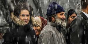 India’s opposition Congress party leaders Rahul Gandhi,centre right and Priyanka Vadra,centre left arrive for a public rally as it snows in Srinagar,Indian controlled Kashmir.